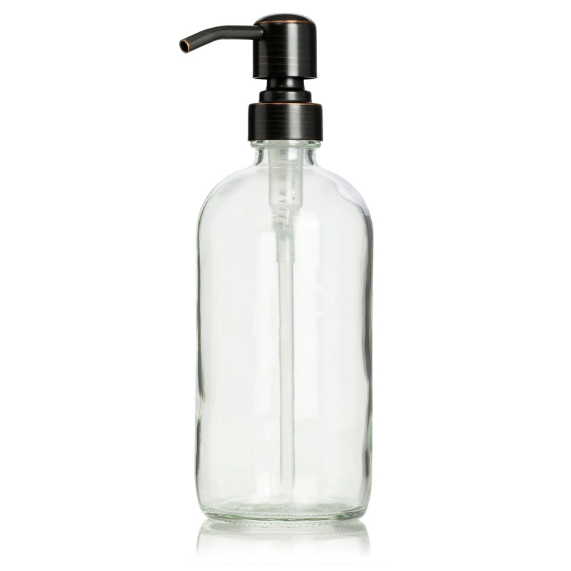 Elegant glass bottle with a black pump and handle, designed for apothecary use, showcasing a stylish bronze dispenser.