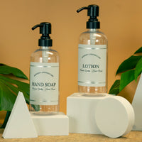 hand soap and lotion pump dispenser set with black stainless steel pumps and pretty labels