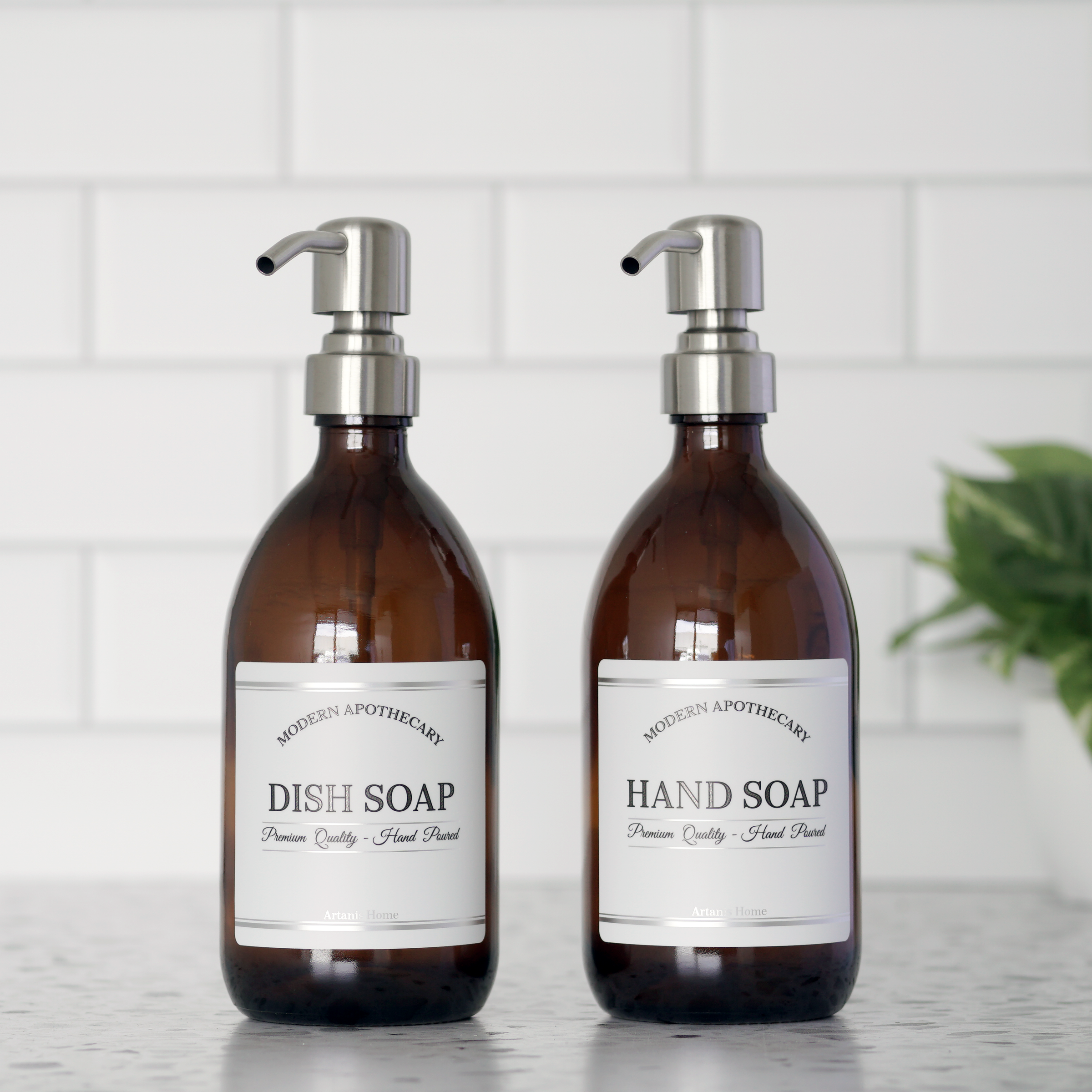 Set of two amber glad apothecary bottles with waterproof chrome accented labels for hand soap and dish soap,  with 304 grade stainless steel pumps. 