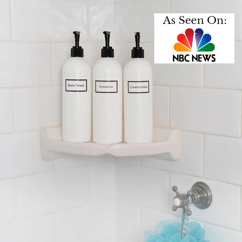 Shower corner shelf with 3 white bottles with black pumps: shampoo, conditioner, and body wash