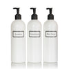Tall white plastic set of shower bottles with black pumps and silkscreen print for shampoo, conditioner, and body wash