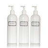 Tall white plastic set of shower bottles with white pumps and silkscreen print for shampoo, conditioner, and body wash