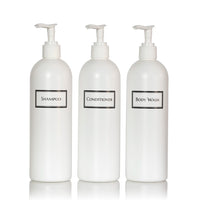 Tall white plastic set of shower bottles with white pumps and silkscreen print for shampoo, conditioner, and body wash